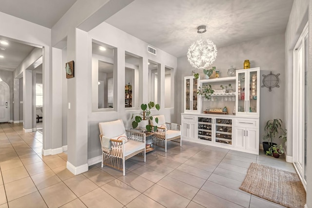 2076 Chennault Ave, Clovis, CA 93611 - living area featuring light tile patterned floors and a chandelier