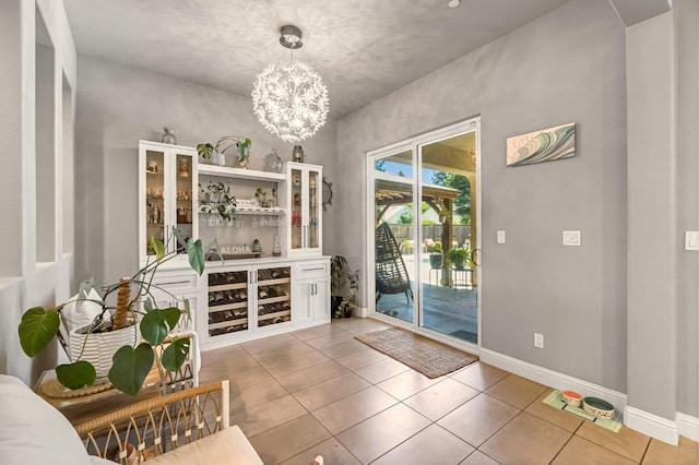2076 Chennault Ave, Clovis, CA 93611 - dining room with a chandelier and light tile patterned floors