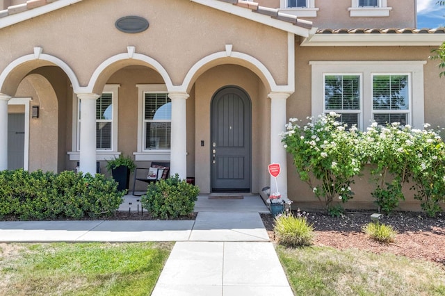 2076 Chennault Ave, Clovis, CA 93611 - entrance to property featuring stucco siding, a tile roof, and covered porch