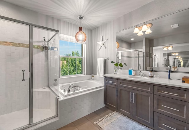 2076 Chennault Ave, Clovis, CA 93611 - bathroom with a garden tub, vanity, and a stall shower