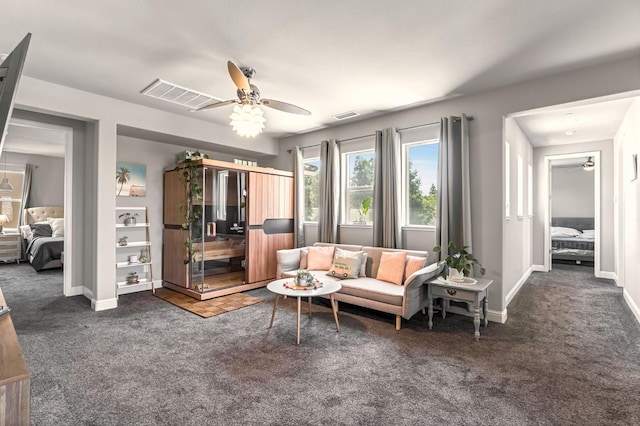 2076 Chennault Ave, Clovis, CA 93611 - living room featuring a ceiling fan and carpet