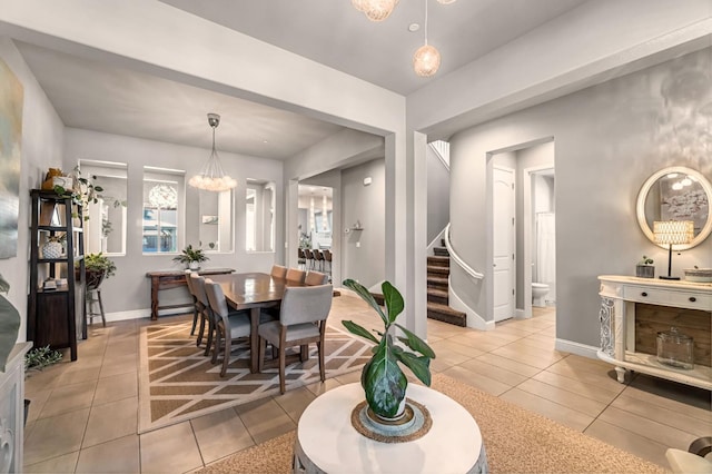 2076 Chennault Ave, Clovis, CA 93611 - dining space with light tile patterned floors, stairway, and a chandelier