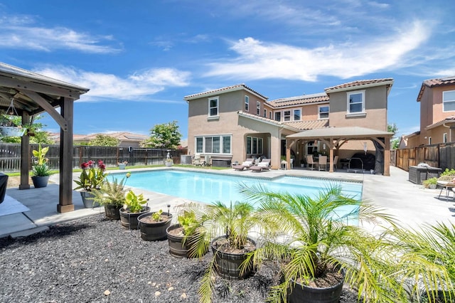 2076 Chennault Ave, Clovis, CA 93611 - view of pool with a gazebo, a fenced backyard, a patio, and an outdoor hangout area