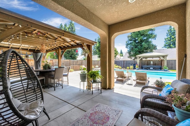 2076 Chennault Ave, Clovis, CA 93611 - fenced backyard with a gazebo, outdoor lounge area, outdoor dining area, and a patio area