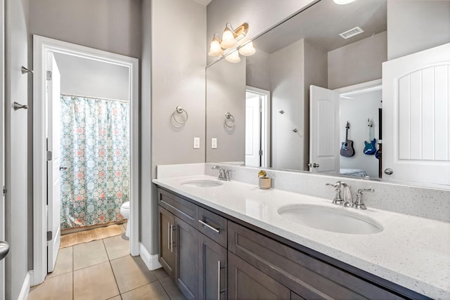 2076 Chennault Ave, Clovis, CA 93611 - bathroom with tile patterned floors, double vanity, and a shower with curtain