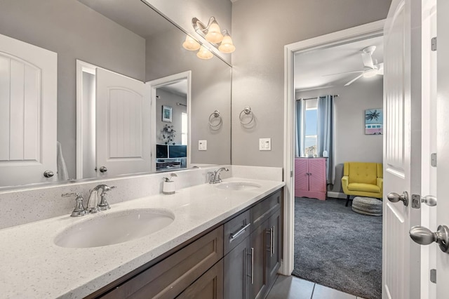 2076 Chennault Ave, Clovis, CA 93611 - ensuite bathroom featuring double vanity, tile patterned floors, and a ceiling fan