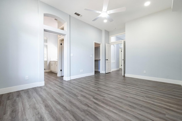 5667 W Bluff Ave, Fresno, CA 93722 - unfurnished bedroom featuring wood finished floors, ensuite bath, a spacious closet, a ceiling fan, and recessed lighting