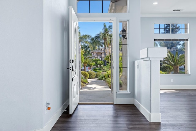 5667 W Bluff Ave, Fresno, CA 93722 - entryway with crown molding and wood finished floors