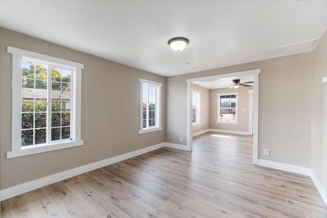 2401 E Hedges Ave, Fresno, CA 93703 - spare room with plenty of natural light, light wood-style floors, and a ceiling fan