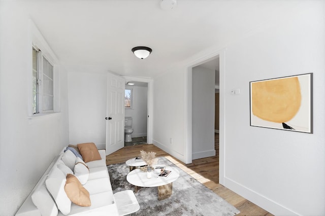 2401 E Hedges Ave, Fresno, CA 93703 - living area featuring light wood-style flooring and baseboards