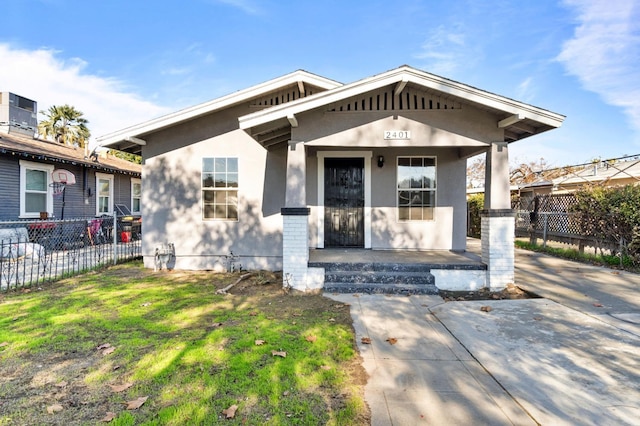 2401 E Hedges Ave, Fresno, CA 93703 - view of front facade with a porch and stucco siding