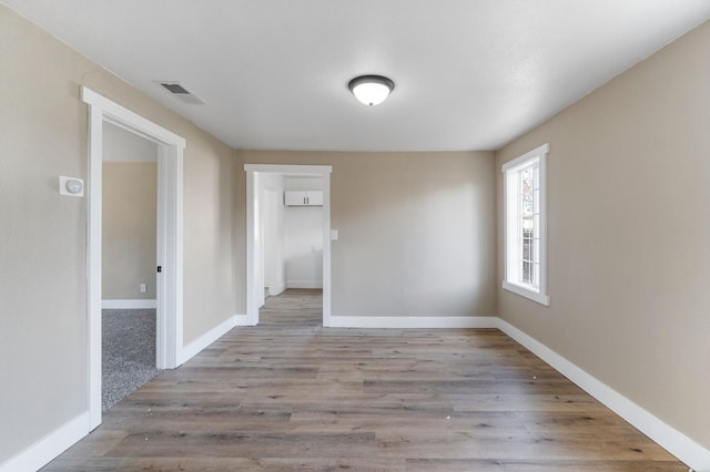 2401 E Hedges Ave, Fresno, CA 93703 - unfurnished room with wood finished floors and baseboards