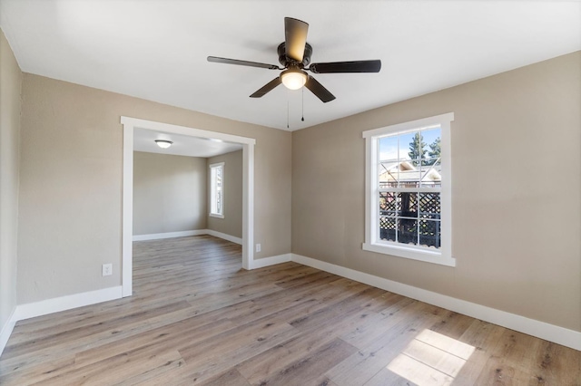 2401 E Hedges Ave, Fresno, CA 93703 - empty room with wood finished floors and a ceiling fan