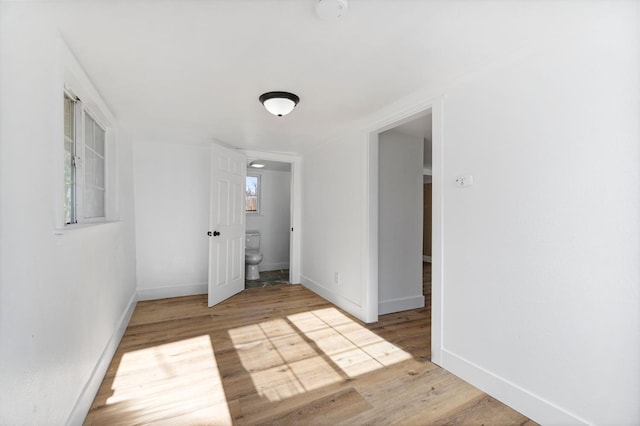 2401 E Hedges Ave, Fresno, CA 93703 - empty room with wood finished floors and a smoke detector