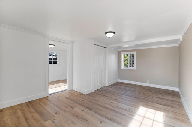 2401 E Hedges Ave, Fresno, CA 93703 - unfurnished bedroom with wood finished floors, a closet, and ornamental molding