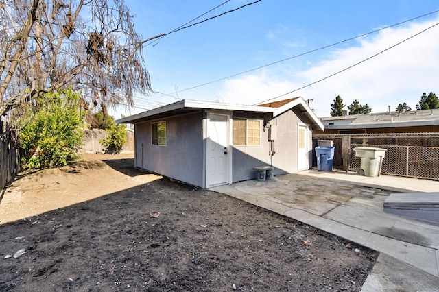 2401 E Hedges Ave, Fresno, CA 93703 - rear view of property featuring a fenced backyard, a patio area, and an outdoor structure
