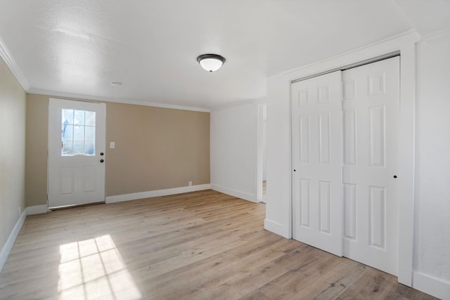 2401 E Hedges Ave, Fresno, CA 93703 - foyer featuring crown molding and light wood-style flooring