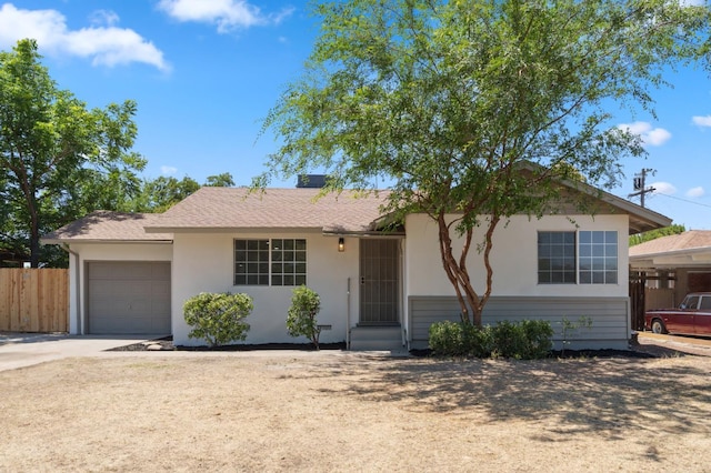 1931 W Ashlan Ave, Fresno, CA 93705 - ranch-style house with a garage, concrete driveway, and stucco siding