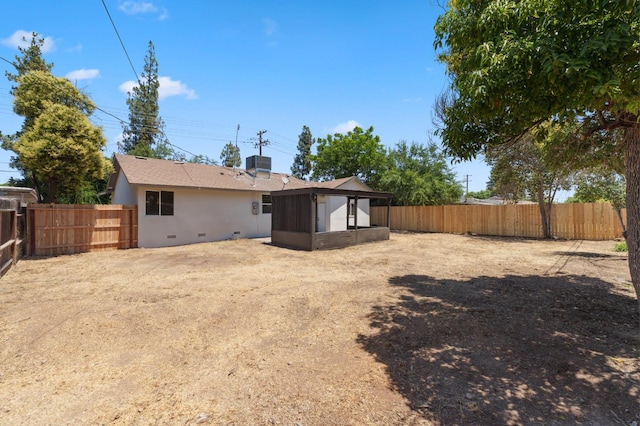 1931 W Ashlan Ave, Fresno, CA 93705 - back of house featuring a sunroom and a fenced backyard