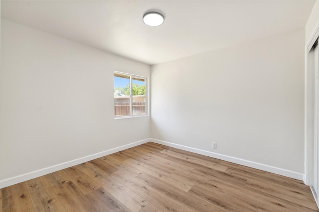 1931 W Ashlan Ave, Fresno, CA 93705 - unfurnished room featuring baseboards and light wood-style flooring