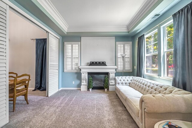 2143 Everglade Ave, Clovis, CA 93619 - carpeted living area featuring crown molding, plenty of natural light, a tray ceiling, and a fireplace