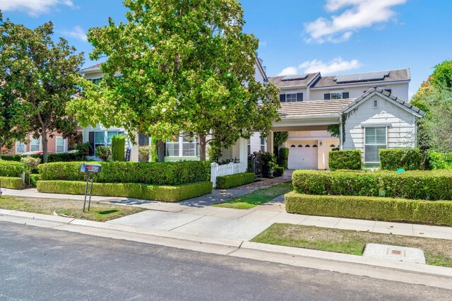 2143 Everglade Ave, Clovis, CA 93619 - view of front of property featuring driveway, roof mounted solar panels, and a tiled roof