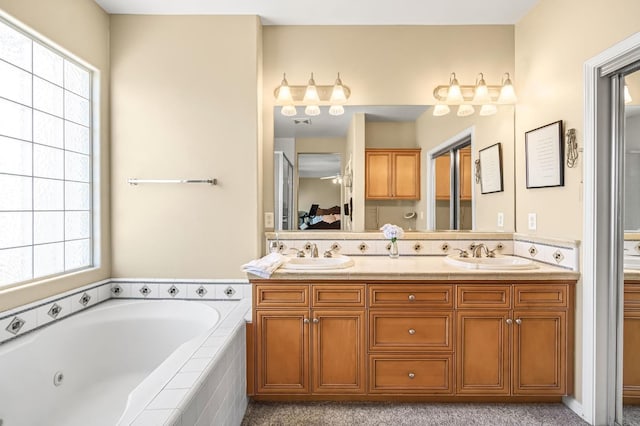 2143 Everglade Ave, Clovis, CA 93619 - ensuite bathroom with a whirlpool tub and double vanity