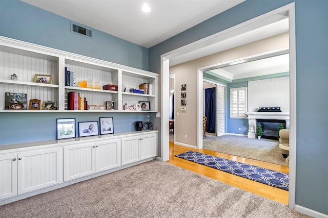 2143 Everglade Ave, Clovis, CA 93619 - hallway with light wood-style floors, ornamental molding, and recessed lighting