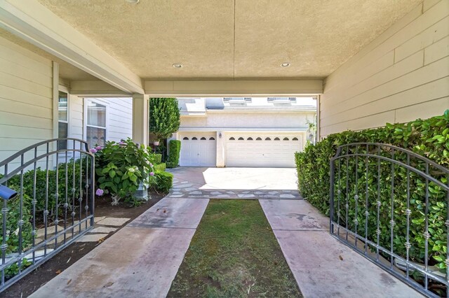 2143 Everglade Ave, Clovis, CA 93619 - view of patio / terrace featuring a garage and driveway