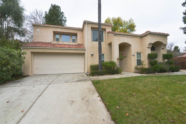 10521 N Doheny Ave, Fresno, CA 93730 - view of front of property featuring stucco siding, a tiled roof, a garage, concrete driveway, and a front yard