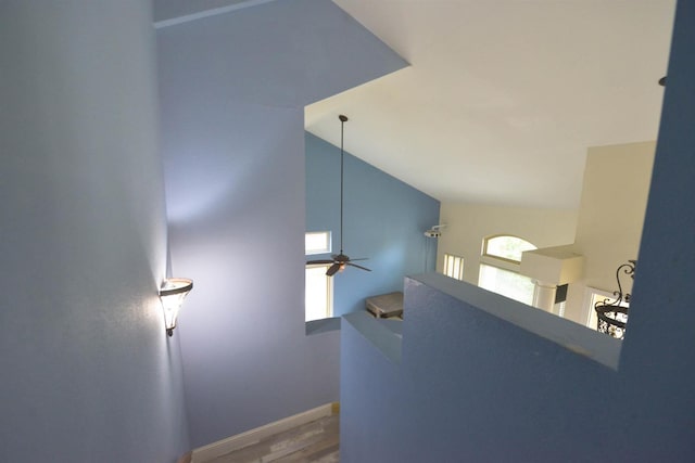 10521 N Doheny Ave, Fresno, CA 93730 - stairs with ceiling fan, wood finished floors, and lofted ceiling