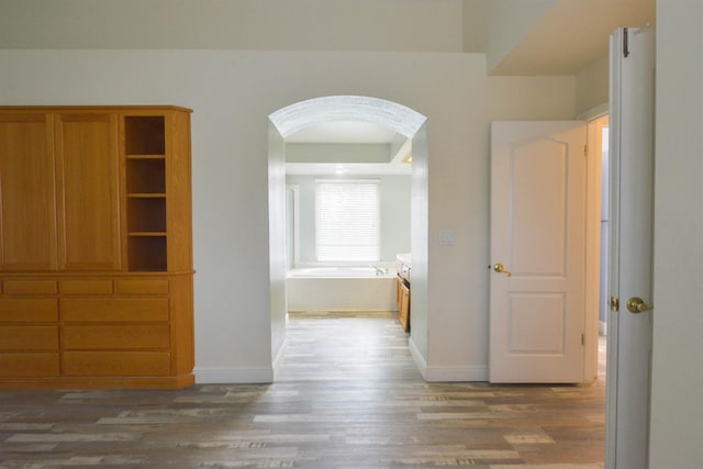10521 N Doheny Ave, Fresno, CA 93730 - corridor featuring wood finished floors and arched walkways