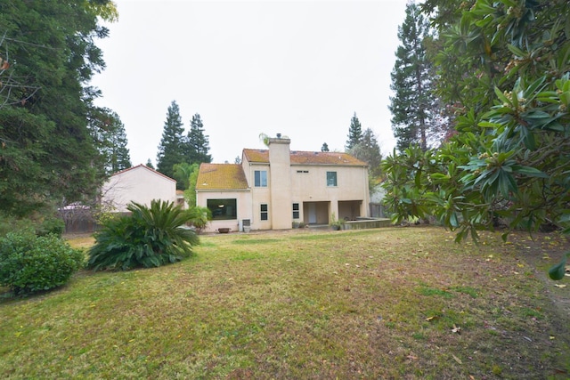 10521 N Doheny Ave, Fresno, CA 93730 - back of house featuring a chimney and stucco siding
