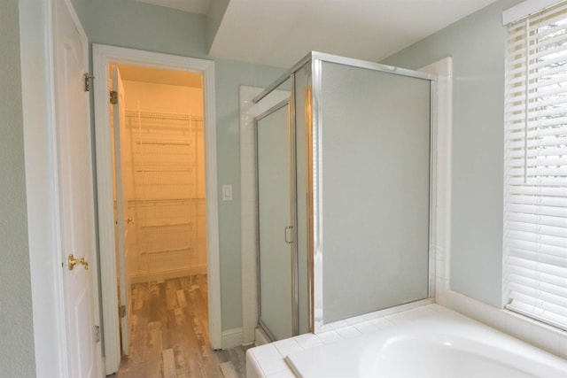 10521 N Doheny Ave, Fresno, CA 93730 - full bath with a shower stall, a spacious closet, a bath, and wood finished floors