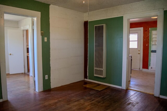 1439 S 4 Th St, Fresno, CA 93702 - unfurnished room with a heating unit and wood-type flooring
