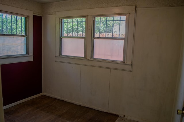 1439 S 4 Th St, Fresno, CA 93702 - spare room with dark wood-style floors and baseboards