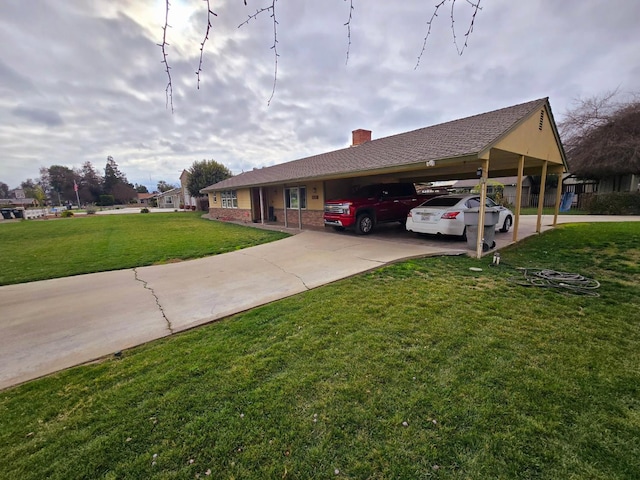 525 N Crenshaw, Visalia, CA 93291 - view of front facade with a front yard, a chimney, an attached carport, and concrete driveway