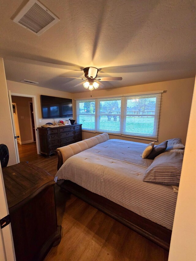 525 N Crenshaw, Visalia, CA 93291 - bedroom featuring wood finished floors, ceiling fan, and a textured ceiling