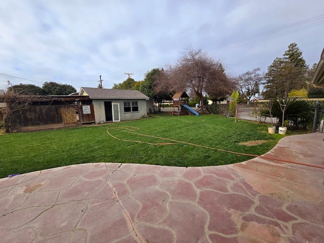 525 N Crenshaw, Visalia, CA 93291 - view of yard with a playground and an outbuilding