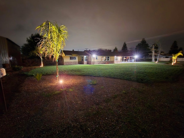 525 N Crenshaw, Visalia, CA 93291 - yard at night featuring a yard