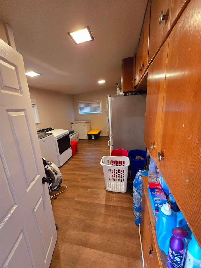 525 N Crenshaw, Visalia, CA 93291 - washroom with washing machine and clothes dryer and wood finished floors