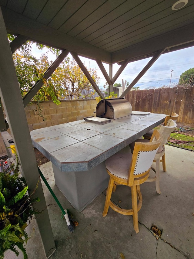 525 N Crenshaw, Visalia, CA 93291 - fenced backyard featuring an outdoor kitchen and a patio