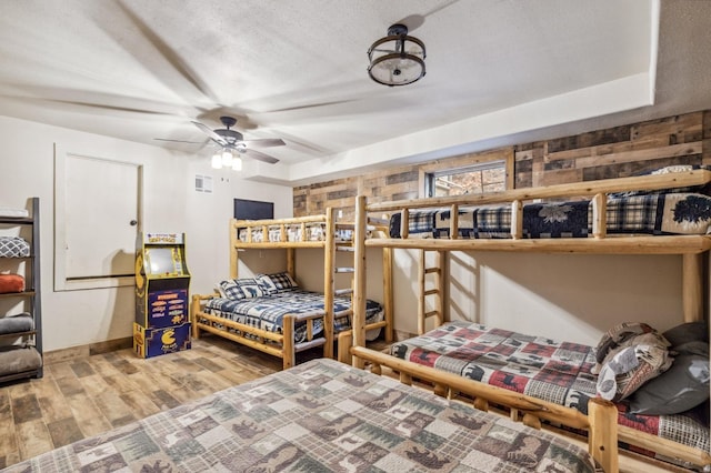 39801 Woody Ln, Shaver Lake, CA 93664 - bedroom featuring wood finished floors and a textured ceiling