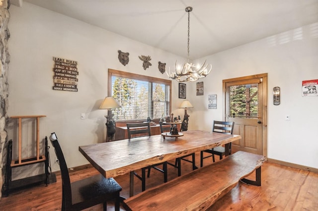 39801 Woody Ln, Shaver Lake, CA 93664 - dining area featuring wood finished floors and a chandelier
