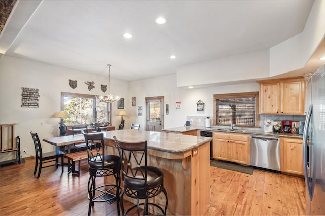 39801 Woody Ln, Shaver Lake, CA 93664 - kitchen with dishwasher, light brown cabinets, light wood-style floors, recessed lighting, and plenty of natural light