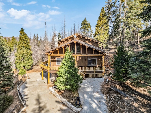 39801 Woody Ln, Shaver Lake, CA 93664 - log cabin with a wooden deck and a chimney