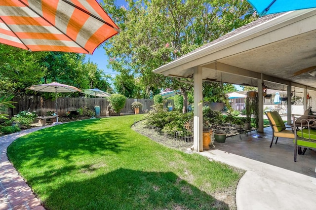 1721 W Wrenwood Ave, Fresno, CA 93711 - fenced backyard featuring a patio