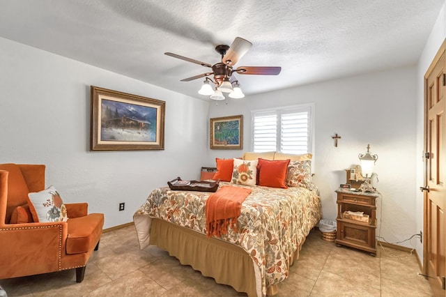 1721 W Wrenwood Ave, Fresno, CA 93711 - bedroom featuring light tile patterned floors, ceiling fan, and a textured ceiling
