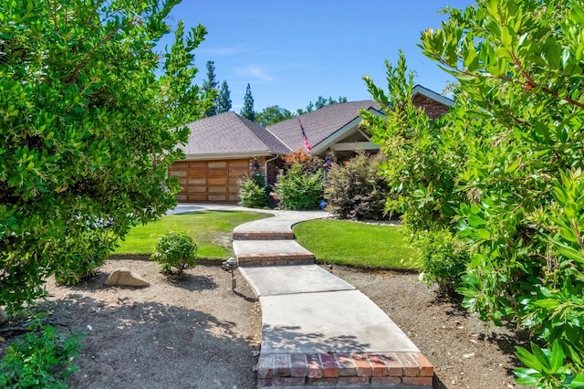 1721 W Wrenwood Ave, Fresno, CA 93711 - view of front of home featuring an attached garage, a front yard, and a shingled roof