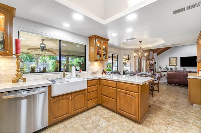 1721 W Wrenwood Ave, Fresno, CA 93711 - kitchen featuring dishwasher, a peninsula, backsplash, open floor plan, and recessed lighting